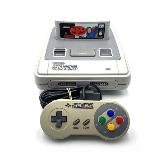 Console Super Nintendo avec manette + Jeu Tintin au Tibet